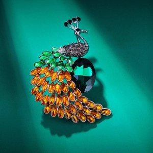 Peacock brooch in silver alloy with green main stone and colorful rhinestone tail feathers
