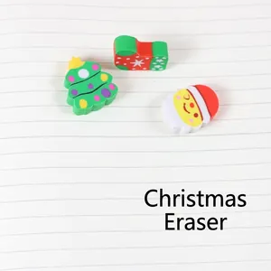 Christmas themed erasers set with Santa and tree designs on notebook background
