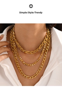 Close-up of triple layered gold plated stainless steel Cuban and Figaro chain necklace
