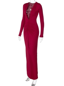 Detail of red deep V-neck dress with ruched front and mermaid silhouette design