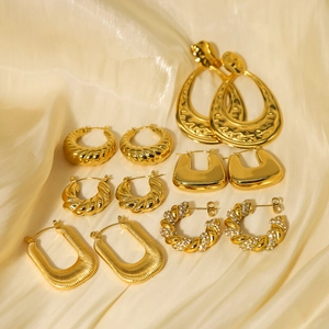 Collection of French vintage gold-plated crescent and twisted hoop earrings for women