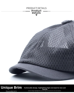 Detailed view of the dark grey sun hat showing breathable honeycomb mesh and short brim