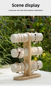 Three-tier bamboo jewelry display stand with grey velvet rollers for bracelets and watches