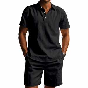 Close-up of black men's linen polo set showing texture, buttons and relaxed summer fit
