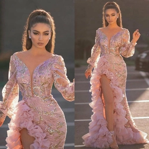 Pink sequin evening gown with deep V-neck, sheer long sleeves, and layered ruffles
