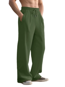 Detail of army green men's wide leg trousers showing vertical corduroy texture and drawstring