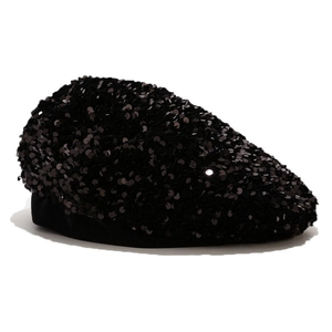 Close-up of shimmering black sequins on a fashion beret hat with high texture detail
