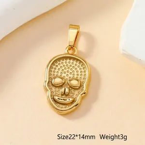Detailed close-up of a gold skull pendant with 22x14mm size and 3g weight specs