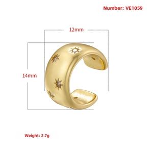Detailed view of a gold C-shaped ear cuff with star patterns and 14x12mm dimensions