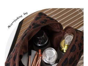 Macro view of leopard print makeup bag showing spacious interior for toiletries