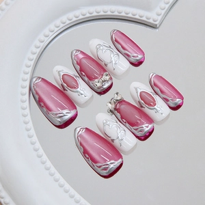 Long almond press-on nails with 3D silver liquid metal heart and bowknot rhinestones