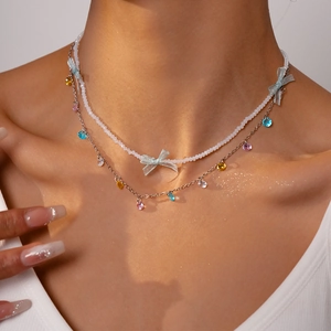 Two-piece stainless steel necklace with blue bow and colorful crystal beads