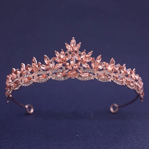 Elegant rose gold bridal tiara with champagne rhinestones in leaf patterns on purple backdrop