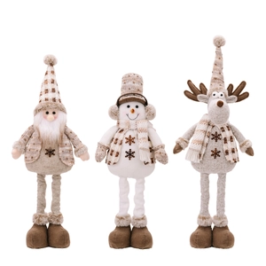Three standing Christmas plush dolls including Santa, Snowman, and Reindeer in knit outfits