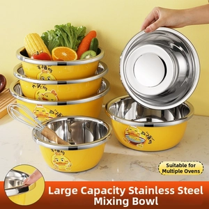 Polished stainless steel yellow cartoon duck prep bowls in a kitchen counter setting