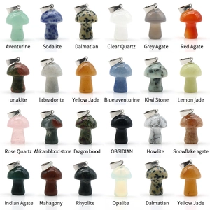 Assorted natural crystal mini mushroom pendants with metal loops in a colorful array