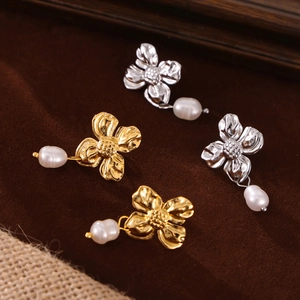 Elegant floral pearl drop earrings in gold and silver finish with white freshwater pearls