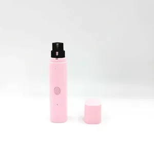 Pink electric pet nail grinder with protective cap for dogs and cats on white background