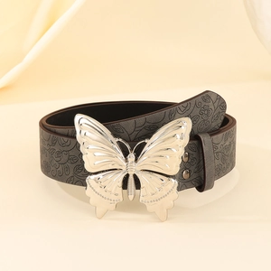 Detailed view of dark grey embossed belt with large silver butterfly buckle feature