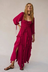 Detail of fuchsia maxi dress with ruffled layers, drawstring waist and side slit detail