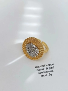 Close-up of 18K gold plated ring with micro-pave crystals and adjustable band detail