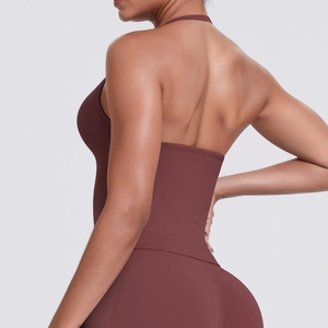 Detail view of the halter neck open-back design on a terracotta yoga sports bra