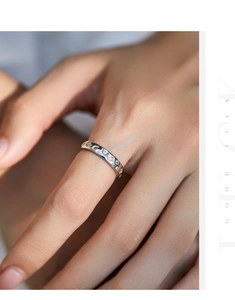 Detail of s925 silver irregular ring with mixed-cut cubic zirconia on model's hand