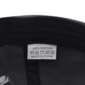 Close-up of the 100% cotton wash label and fabric interior of the baseball cap