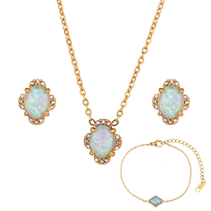Macro detail of 18K gold-plated flower petal jewelry set with oval opal and rhinestones