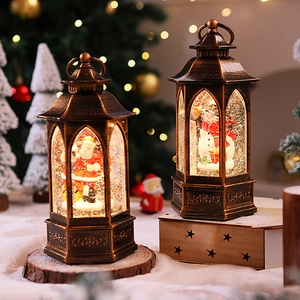 Close-up of retro bronze Christmas lantern featuring Santa scene with warm LED lighting
