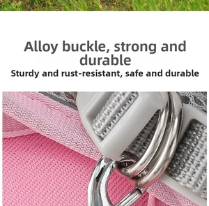 Close-up of pink breathable mesh dog harness with durable silver alloy D-ring and buckle