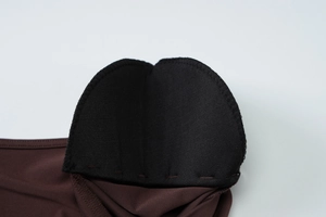 Macro view of high-quality stitching and knitted fabric texture on the shoulder padding