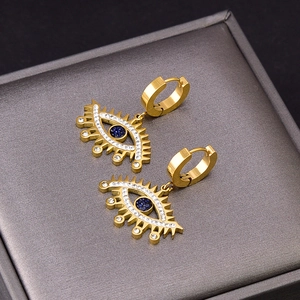 Boucles d'oreilles créoles œil du diable dorées avec cristaux et pierres bleues