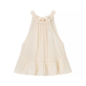 Chic cream halter neck top featuring lace patchwork and ruffled hem on white background