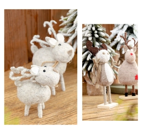 Handcrafted wool felt reindeer figurine with rustic rope details and wooden base