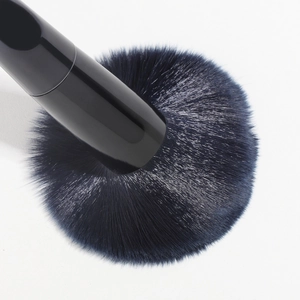 Blue synthesis fiber makeup brush with black glossy handle for loose powder application