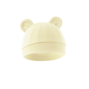 Close-up of yellow knit baby bear hat with cute ears and soft elastic cotton texture