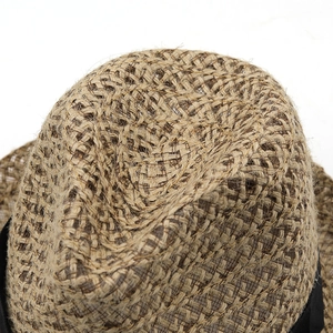 Summer straw fedora hat in light brown with woven texture and black ribbon band detail