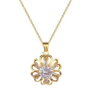 Elegant gold hollow flower necklace with sparkling crystal pendant on white background