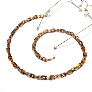 Amber tortoiseshell and gold link eyewear chain with adjustable silicone ends