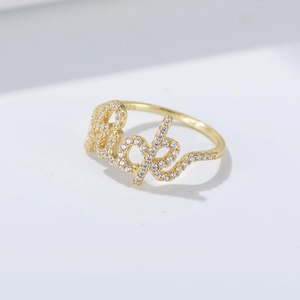 Macro shot of S925 sterling silver stamp on the inner band of a gold-plated Rich ring