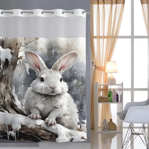 Detail of waffle print shower curtain with silver metal rings and watercolor bunny pattern