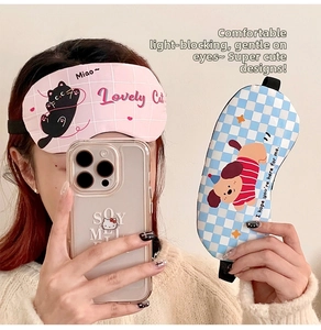 Close-up of cute cartoon cat and dog sleeping masks with elastic bands for eye relief
