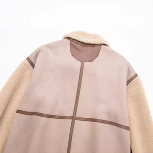 Women's faux shearling jacket with beige suede paneling and leather trim on back