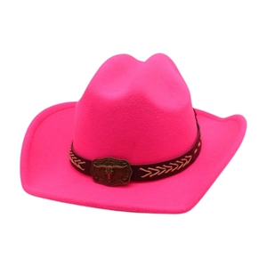 Hot pink western cowboy hat with black band and bronze bull skull emblem on white background