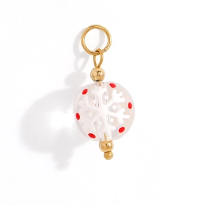 Macro detail of Christmas snow globe pendant with white snowflakes and gold hardware
