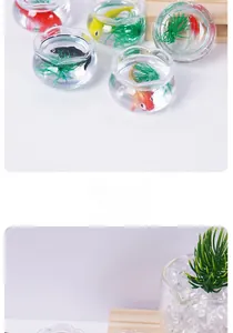 Macro detail of miniature fish tank model with resin koi fish and green water plants