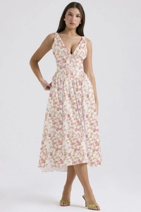 Detailed view of white floral maxi dress featuring a V-neck and slim fit waist design