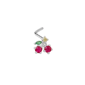 Detailed macro shot of an L-shaped cherry nose stud with red and green zircon stones