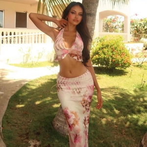 Bohemian two-piece floral set with halter crop top and high-waist maxi skirt for summer